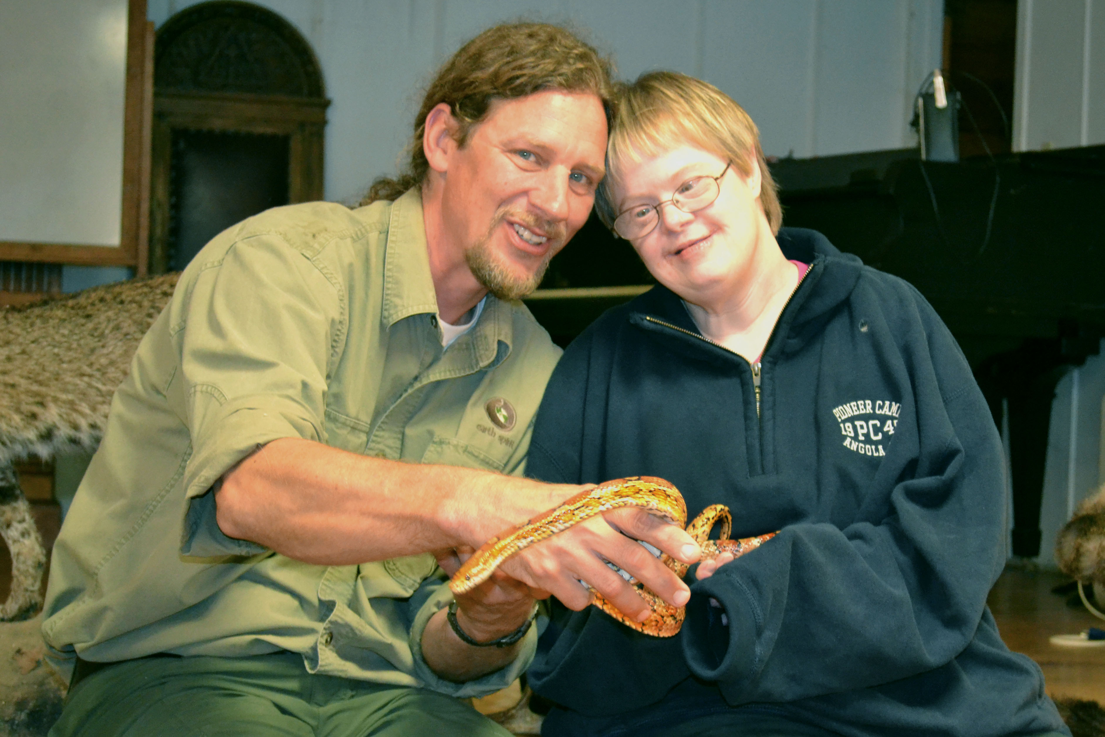 EarthSpirit staff showing vacationer a snake at People and Places’ Annual Fall Getaway.